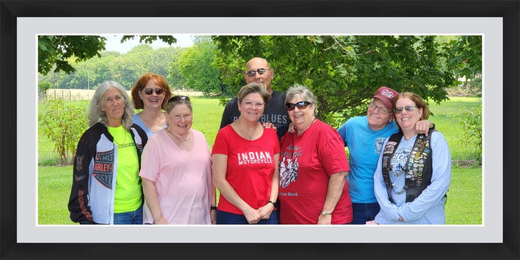 Framed photo of a group of smiling women outdoors