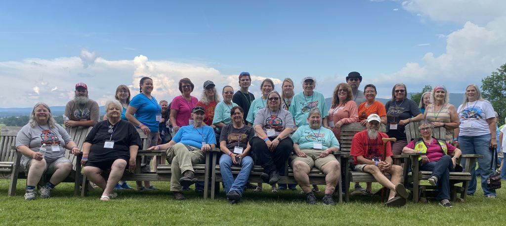 Group of Missouri members seated together on a lawn